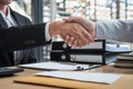 Handshake after finishing conversation Businessman sending a resignation letter to employer boss in order to resign dismiss