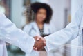 Handshake, future and collaboration of doctors in labcoats shaking hands making deal in partnership. Trust and support Royalty Free Stock Photo