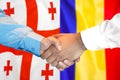 Handshake on Georgia and Moldova flag background