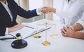 Handshake after good cooperation greeting, Having meeting with team at law firm, Consultation between a female lawyer and