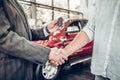 Handshake and handing over the keys to the car by the salon consultant to the buyer