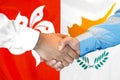 Handshake on Hong Kong and Cyprus flag background Royalty Free Stock Photo