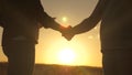 Handshake, joint work of farmers. Business people shake hands in a wheat field in the sun. Business, teamwork. A male