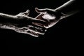 Handshake. Men holding hands isolated on black. Connection and human relations. Male hands rescue. Friendly handshake Royalty Free Stock Photo