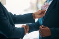 Handshake, money and bribery deal between businessmen in partnership in a corporate company office. Corruption, money Royalty Free Stock Photo