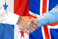 Handshake on Panama and Iceland flag background