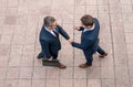 Handshake with partner in the city for greeting. Business men in suit shaking hands outdoors. Business idea. Business Royalty Free Stock Photo
