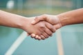 Handshake, partnership and sports outdoor, team or support with fitness closeup. People shaking hands, athlete