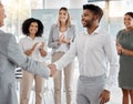 Handshake, promotion and applause with a business man shaking hands with his manager, leader or boss during a meeting in