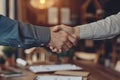 Handshake between real estate agent,client after signing mortgage agreement against background of documents,real estate investment Royalty Free Stock Photo