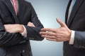 Handshake refuse. Man is refusing shake hand with businessman who is offering his hand Royalty Free Stock Photo