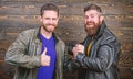 Handshake symbol of successful deal. Have agreed. Brutal bearded men wear leather jackets shaking hands. Strong Royalty Free Stock Photo