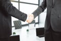 Handshake of two businessmen in office Royalty Free Stock Photo