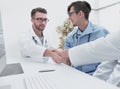 Handshake between the two doctors during the working meeting Royalty Free Stock Photo