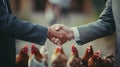 handshake of two men in business suits on the background of chickens on farm