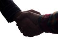 Handshake of two men, businessman and worker - horizontal silhouette Royalty Free Stock Photo