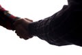 Handshake of two men, businessman and worker - horizontal silhouette Royalty Free Stock Photo