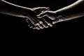 Handshake between the two partners. Rescue or helping gesture of hands. Concept of salvation. Hands of two people at the