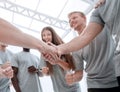 Handshake of young people in a circle of friends Royalty Free Stock Photo