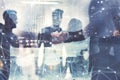 Handshaking business person in office. concept of teamwork and partnership. double exposure Royalty Free Stock Photo