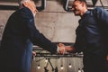 Handshaking business person in office. concept of teamwork and partnership.