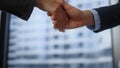 Businessman and businesswoman handshaking. Employee shaking hands at meeting Royalty Free Stock Photo