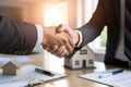 Handshaking between real estate agent and client in office. Generative AI Royalty Free Stock Photo