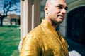 Handsom Indian Man in Gold Kurta at the Temple