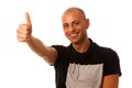 Handsom young man gesturing success with thumb up isolated over