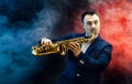 Handsome adult man playing saxophone Royalty Free Stock Photo