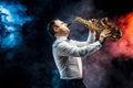 Handsome adult man playing saxophone Royalty Free Stock Photo