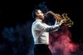 Handsome adult man playing saxophone Royalty Free Stock Photo