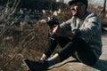 handsome adult man with vintage film camera sitting Royalty Free Stock Photo