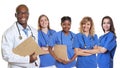 Handsome african american doctor with group of international nurses Royalty Free Stock Photo