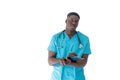 A handsome African-American doctor in a turquoise robe and taking notes standing on a white isolated background. Royalty Free Stock Photo
