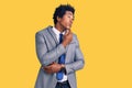 Handsome african american man with afro hair wearing business jacket thinking worried about a question, concerned and nervous with Royalty Free Stock Photo