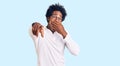 Handsome african american man with afro hair wearing casual clothes and glasses laughing at you, pointing finger to the camera Royalty Free Stock Photo