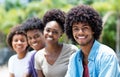 Handsome african american man with group of young adults in line Royalty Free Stock Photo