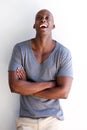 Handsome african american man laughing with arms crossed Royalty Free Stock Photo