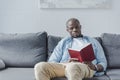 Handsome african american man reading book Royalty Free Stock Photo