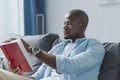 Handsome african american man reading book Royalty Free Stock Photo