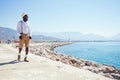 Handsome african american person casual fashion look outfit in straw hat,white shirt walking by Tyrkey coast Royalty Free Stock Photo