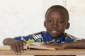 Handsome African black boy studying a Book in Bamako, Mali