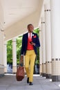 Handsome african businessman walking with cell phone Royalty Free Stock Photo