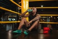 Handsome African male boxing fighter training at the gym