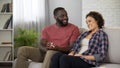 Handsome afro-american man giving engagement ring to his woman, making proposal Royalty Free Stock Photo