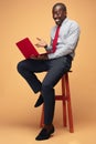Handsome Afro American man sitting and using a laptop Royalty Free Stock Photo