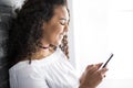 Handsome Afro American teen using a smart phone Royalty Free Stock Photo