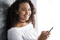 Handsome Afro American teen using a smart phone Royalty Free Stock Photo