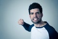 Handsome angry young man with furious face looking disgusted. Human expressions and emotions Royalty Free Stock Photo